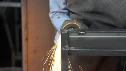Grinding a weld seam smooth.