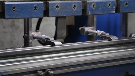 Precision-drilled steel rails.