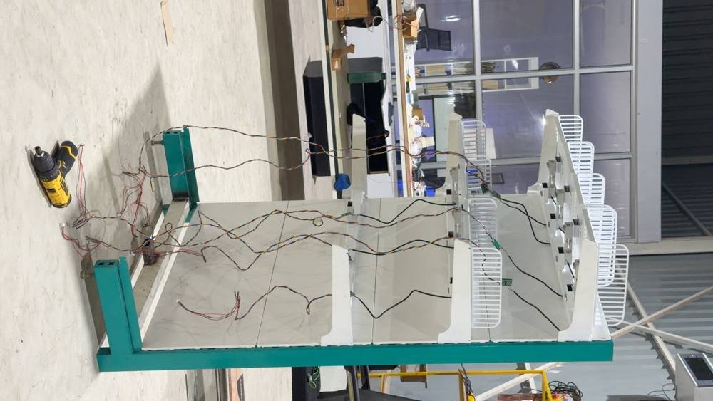 Inside the workshop — HVAC and ducting overhead.