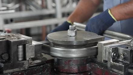 Welding a round part on a rotary jig.