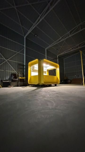 BAPSULE pod lit up inside the factory