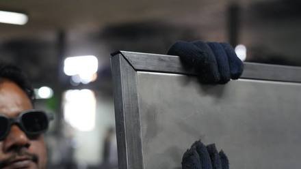 Checking a folded sheet-metal enclosure.
