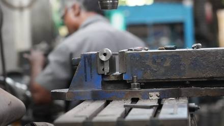 Turning a part on the lathe.